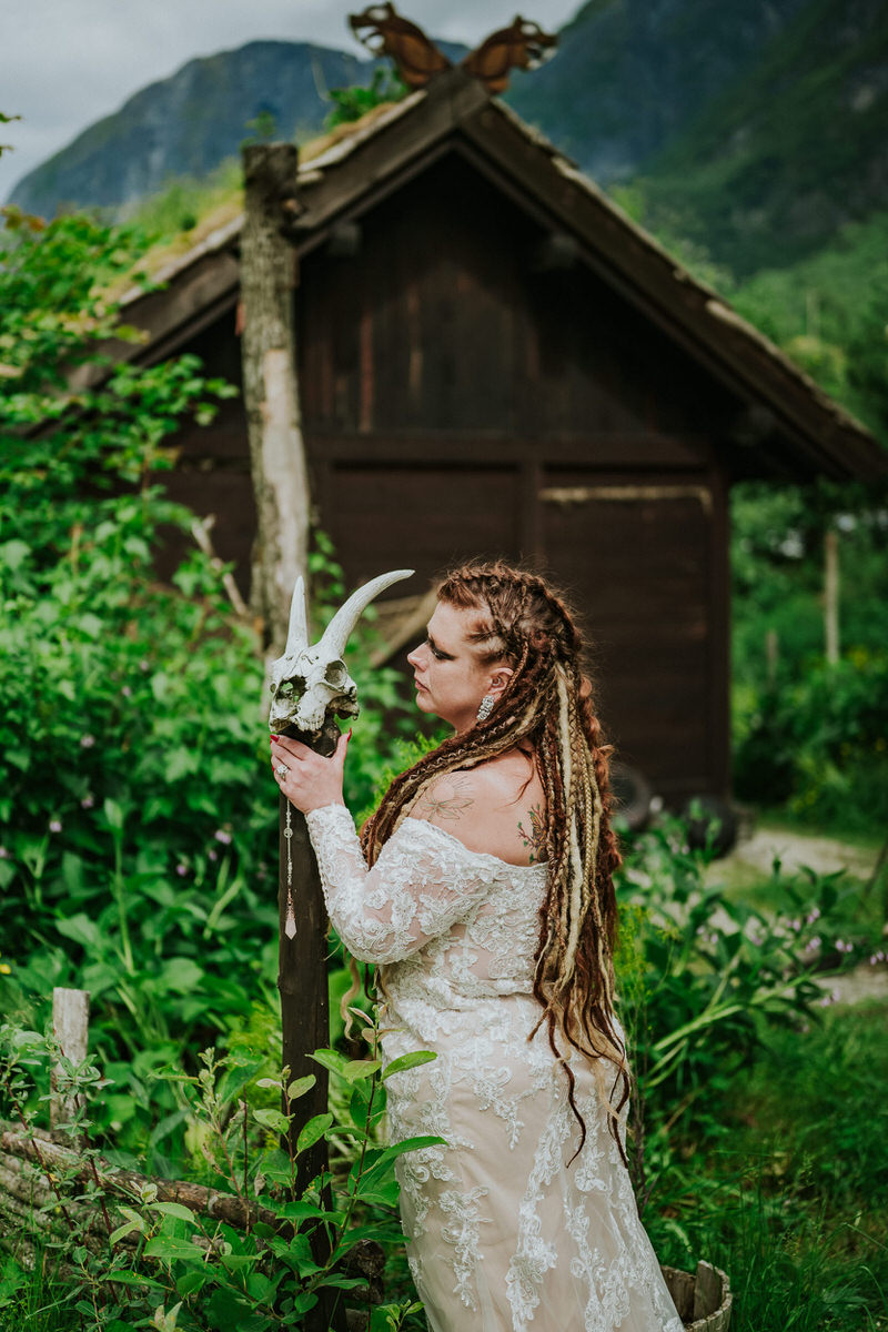Viking bride syled as Lagertha posing in the viking village Njardarheimr in Gudvangen Norway on the day of her viking elopement in Norway